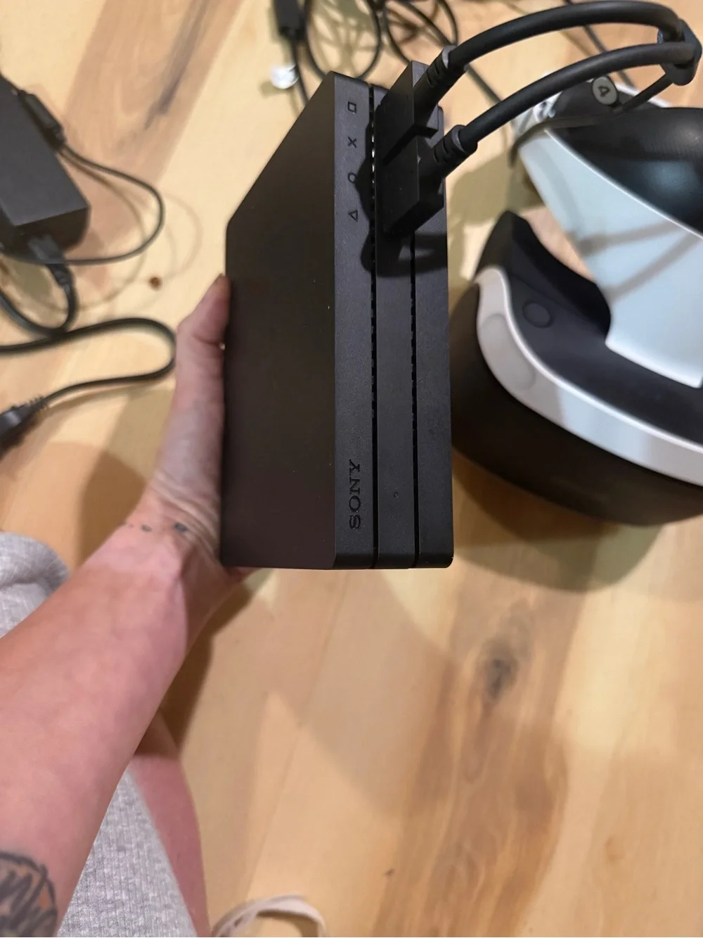 Sony PSVR headset with Black motion controllers and White headset accents